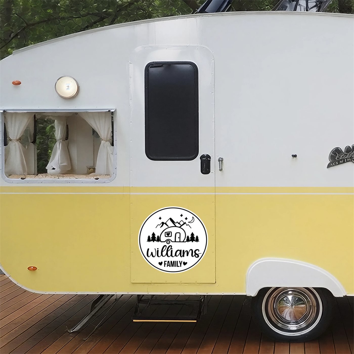 Personalized family name camp door decal with a vintage teardrop camper design on a retro travel trailer door