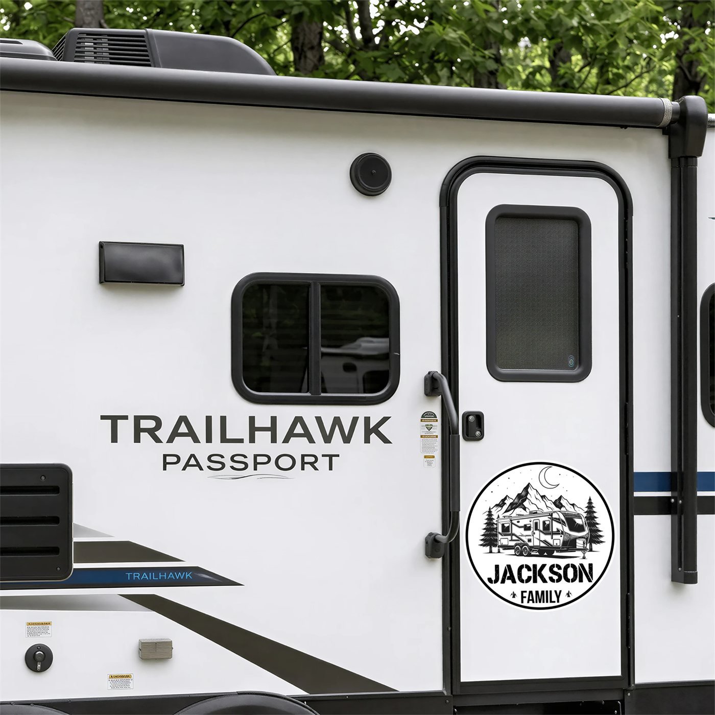 Personalized family name decal with a travel trailer and mountains design on a modern travel trailer entry door