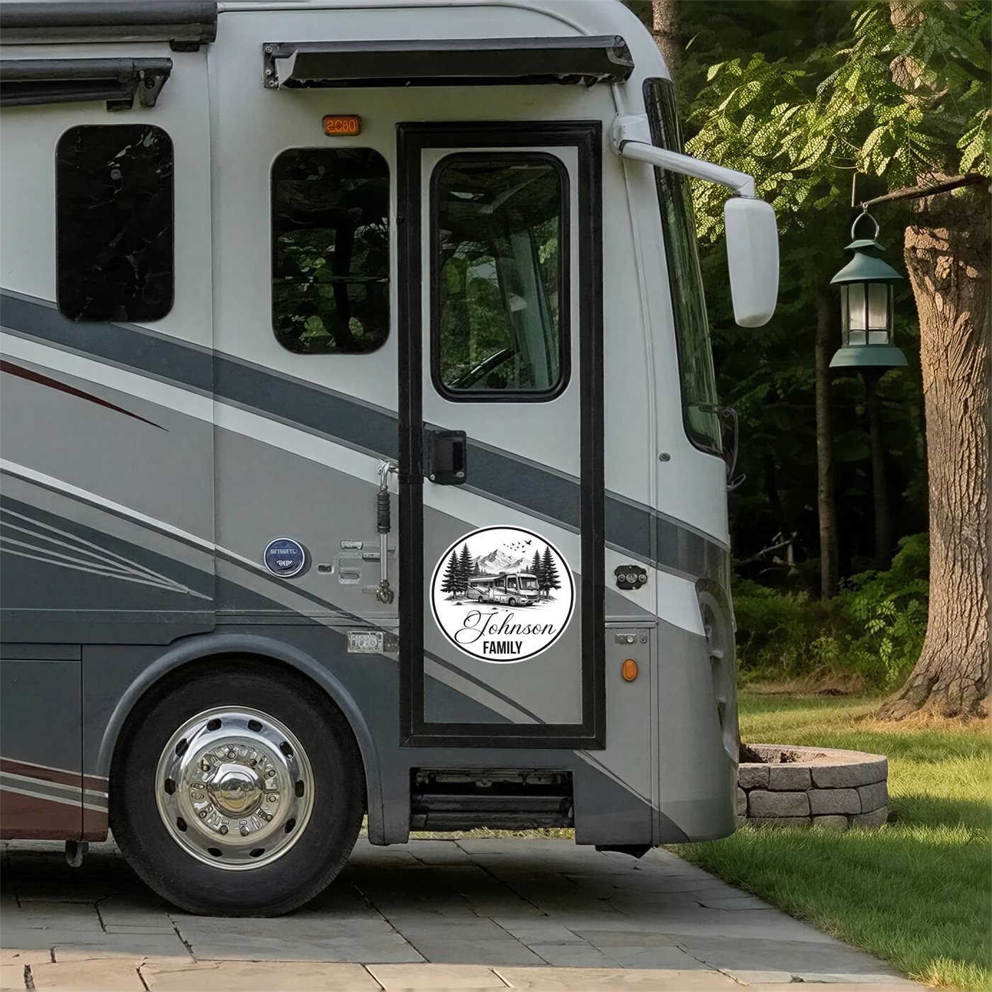 Personalized family name decal with a Class A motorhome and mountains design on a motorcoach entry door
